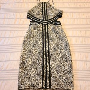Madison Square black and white lace halter dress with side cutouts, size Medium